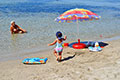 family sunbathing greek sun zante
